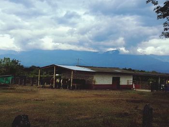 View of landscape against cloudy sky