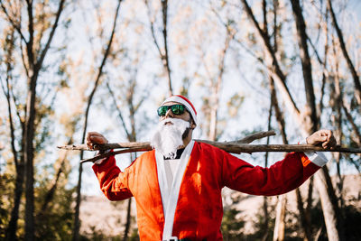 Man wearing costume while standing in forest