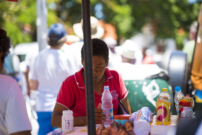 People looking at market stall