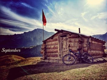 Bicycles on mountain against sky