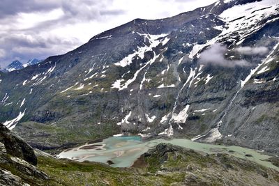 Scenic view of garnierung lake and snowcapped mountains against sky