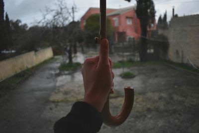 Close-up of human hand on road