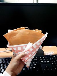 Close-up of hand holding ice cream