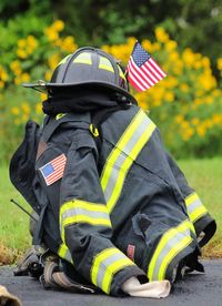 Close-up of military uniform with american flag on road