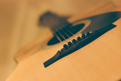 Close-up of guitar on table