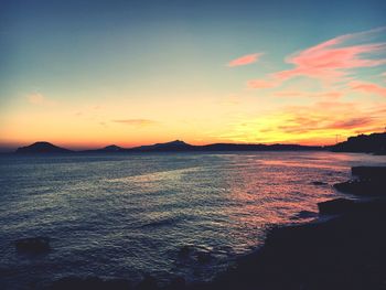 Scenic view of sea against sky at sunset