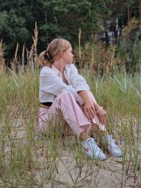 Beautiful girl in sitting near the jurmala beach