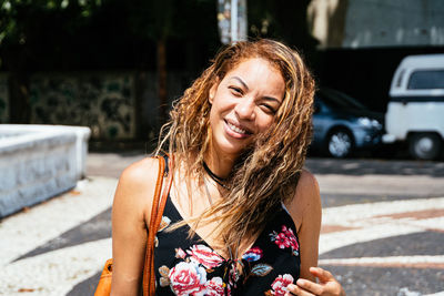 Portrait of a smiling young woman with long brown hair