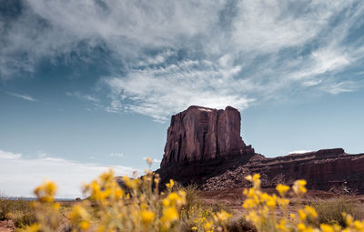 Rock formations on landscape against sky