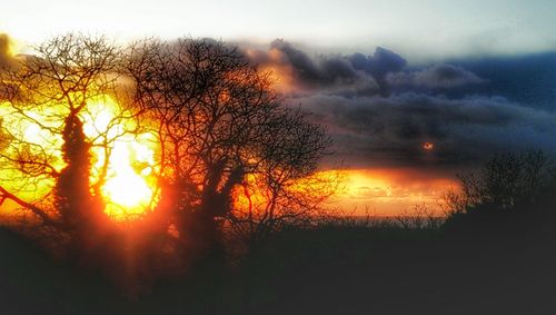 Scenic view of landscape against sky at sunset