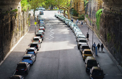 Vehicles on road along buildings