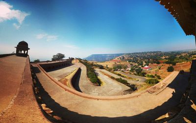 Panoramic view of city against blue sky