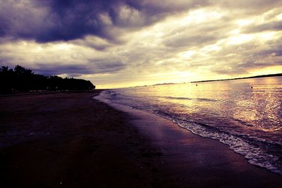 Scenic view of sea against cloudy sky