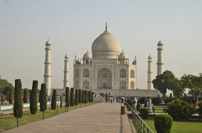 Front view of taj mahal surrounded by garden