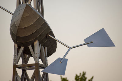 Low angle view of traditional windmill against clear sky