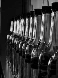 Close-up of wine bottles on rack