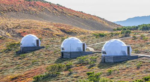 White glamping on the slope of a volcano in autumn on the kamchatka peninsula