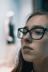 Close-up of young woman wearing eyeglasses