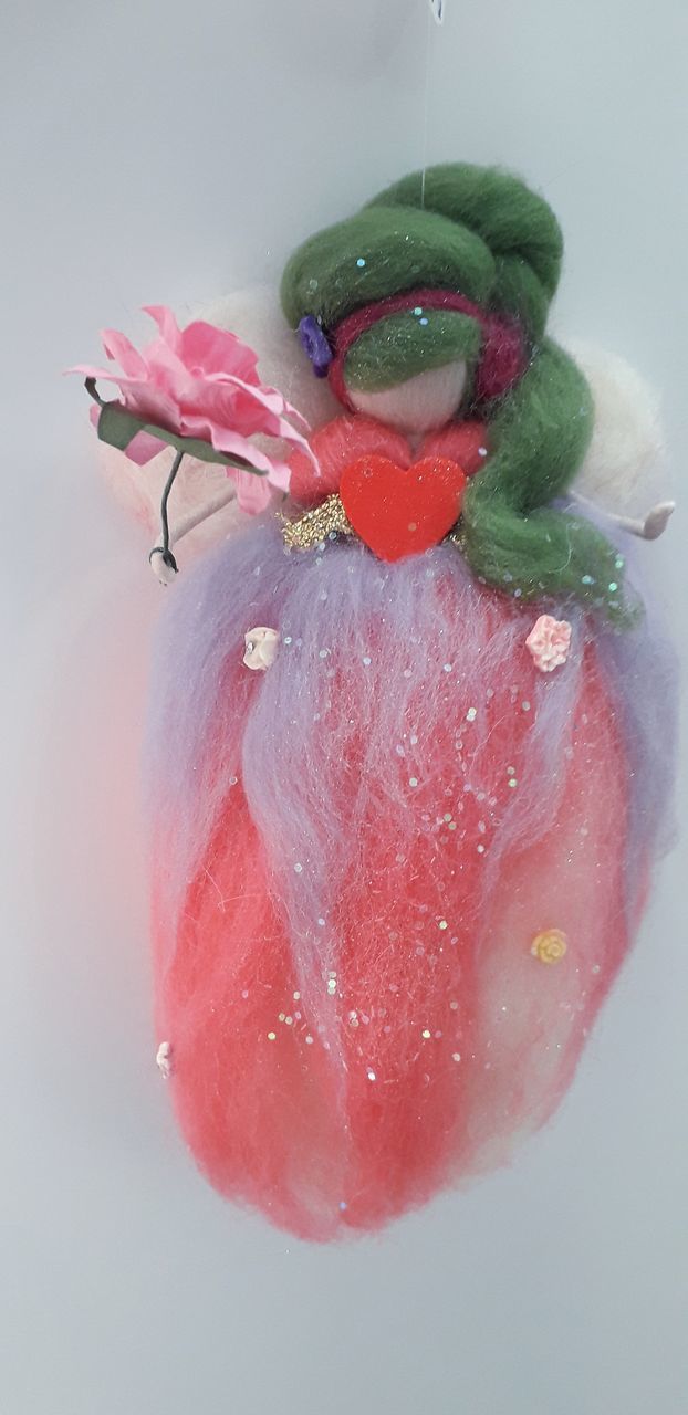 CLOSE-UP OF PINK ROSE FLOWER IN WATER