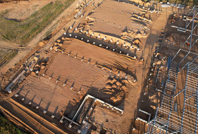 High angle view of vehicles on road along buildings