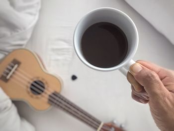 Woman holding coffee cup