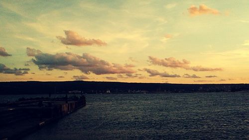 Scenic view of sea against sky at sunset