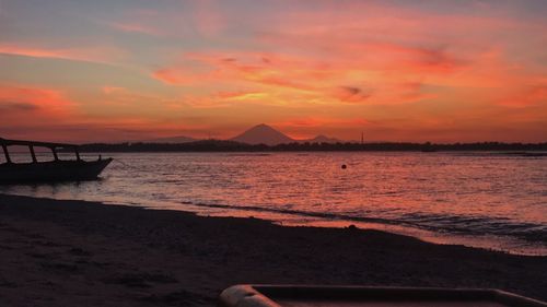 Scenic view of sea against orange sky