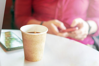 Close-up of coffee cup on table