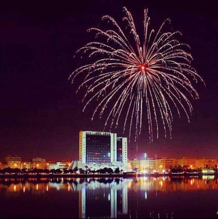 night, illuminated, firework display, celebration, water, long exposure, exploding, firework - man made object, waterfront, arts culture and entertainment, glowing, reflection, motion, sparks, sky, building exterior, event, firework, entertainment, multi colored