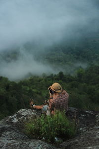 Man photographing landscape
