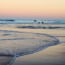 Scenic view of sea at sunset
