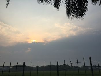 Scenic view of field against sky during sunset