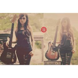 Portrait of young woman with guitar