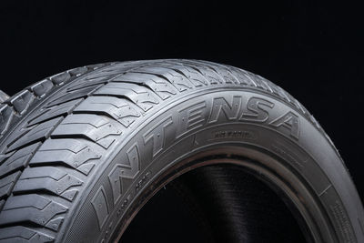 Close-up of tire against black background