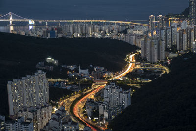 High angle view of illuminated buildings in city at night