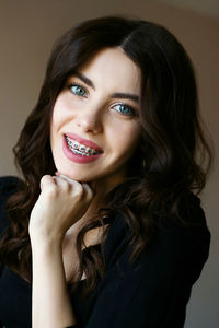 Portrait of a smiling young woman with braces