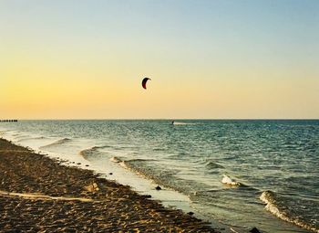 Scenic view of sea against clear sky during sunset