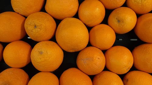 Full frame shot of oranges in market