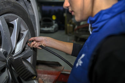 Midsection of man working in workshop