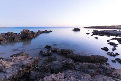 Scenic view of sea against blue sky