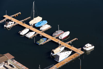 High angle view of boats moored against clear sky