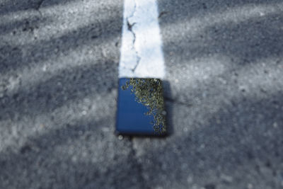 High angle view of arrow sign on road