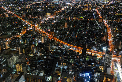 High angle view of illuminated buildings in city