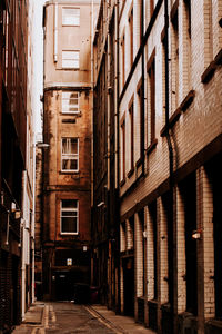 Glasgow alleyway. narrow and grimy.
