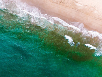 High angle view of waves in sea