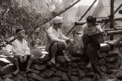 Rear view of people sitting outdoors