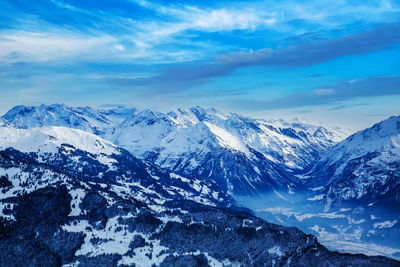 Scenic view of snowcapped mountains against sky