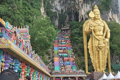 Statue of temple against building