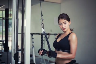 Portrait of woman exercising at gym