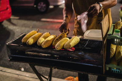 High angle view of people on barbecue grill